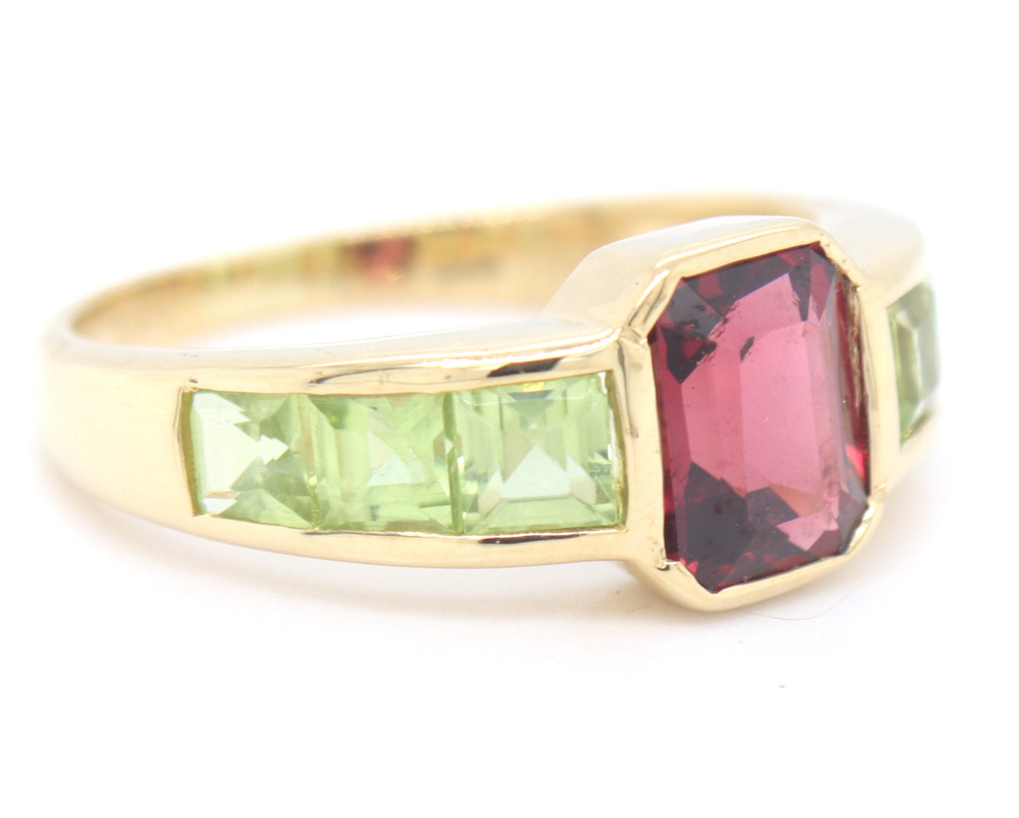 18kt Yellow gold Emerald cut garnet and square peridot bezel set ring