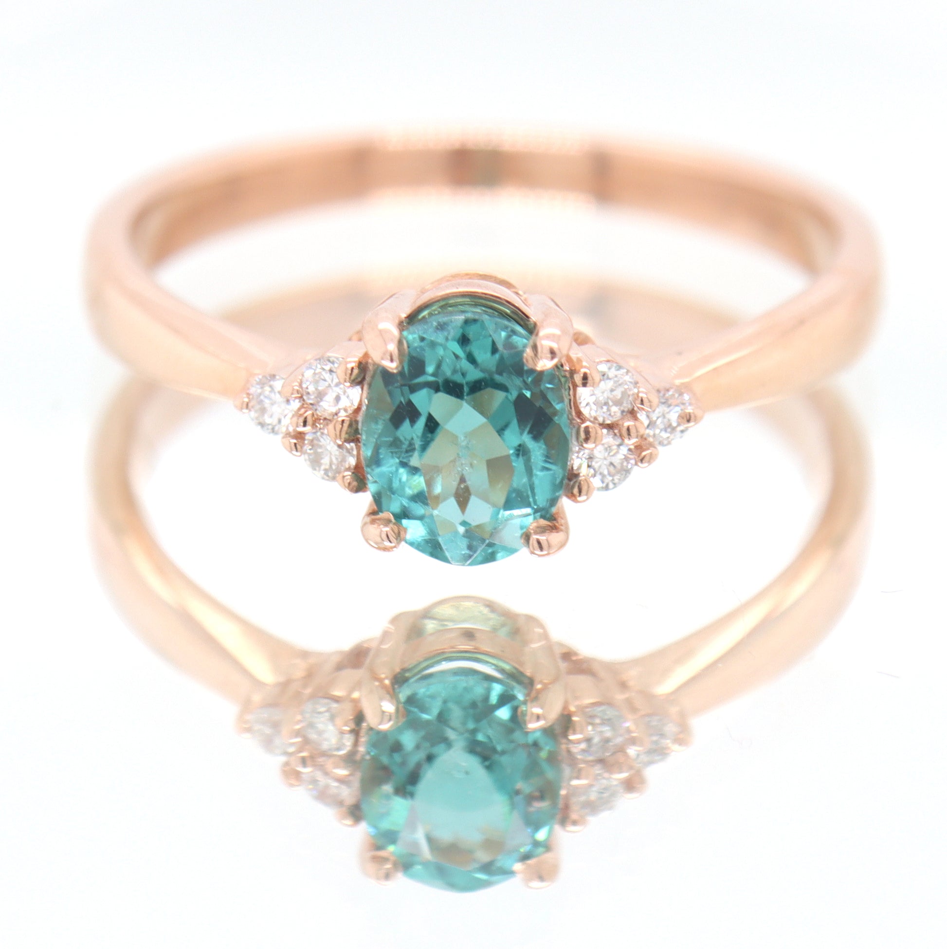 14kt Rose Gold oval Blue Zircona and Diamond Ring