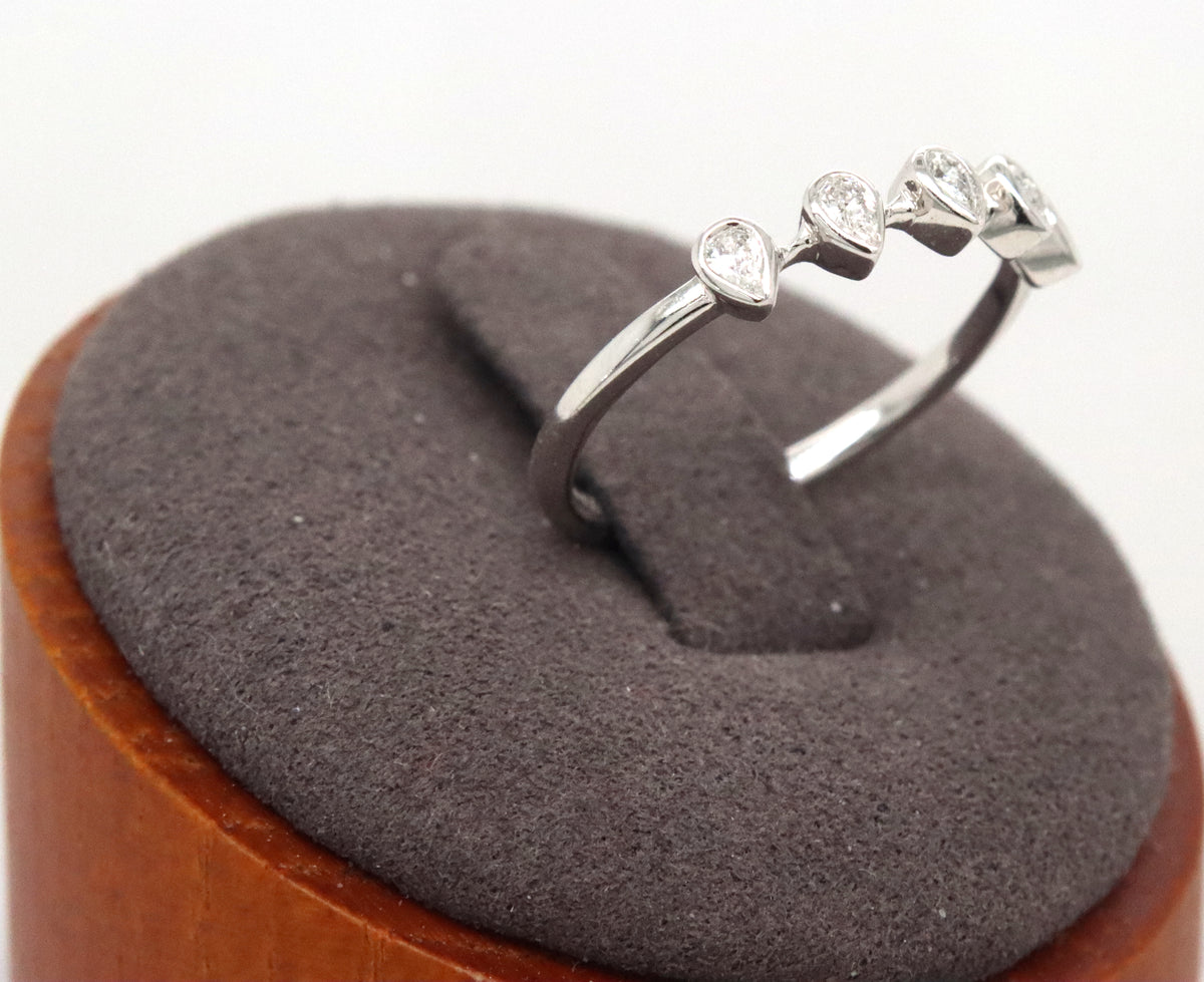 14kt White gold pear shaped bezel set diamond ring