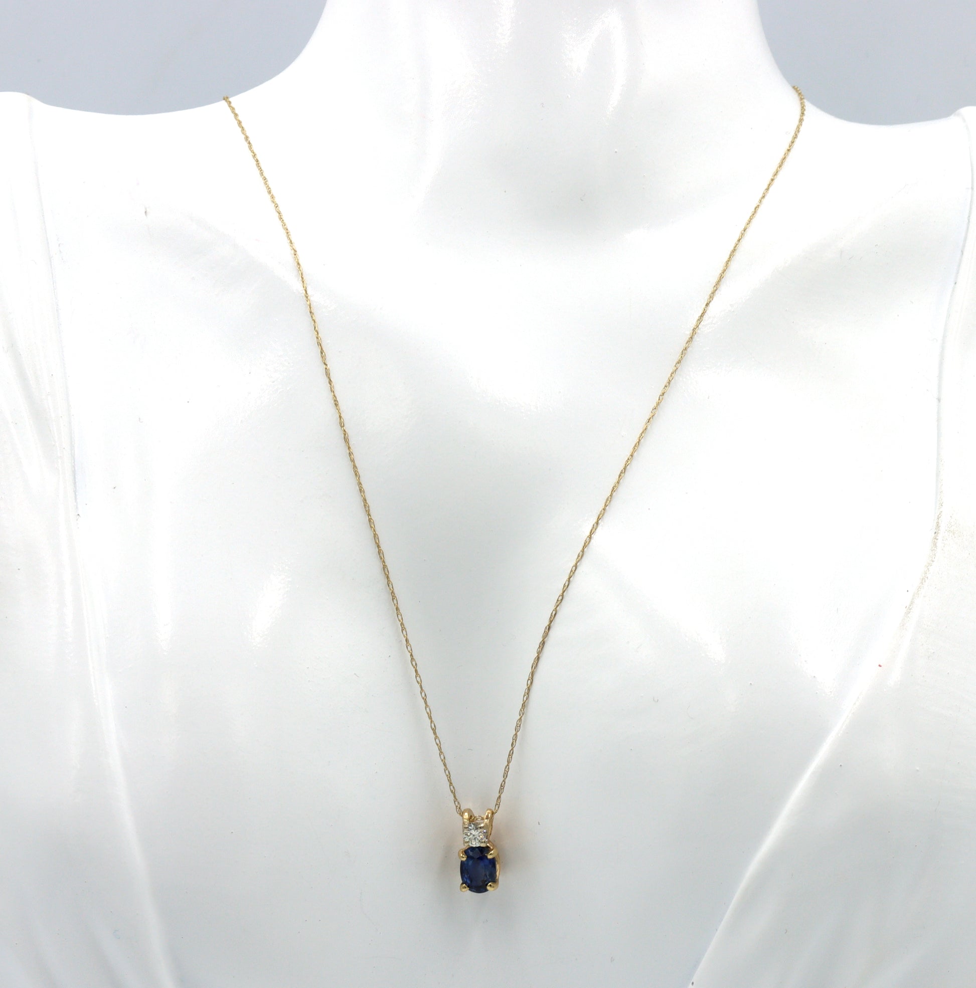 10kt Yellow gold 1.10ct oval sapphire and diamond pendant on chain