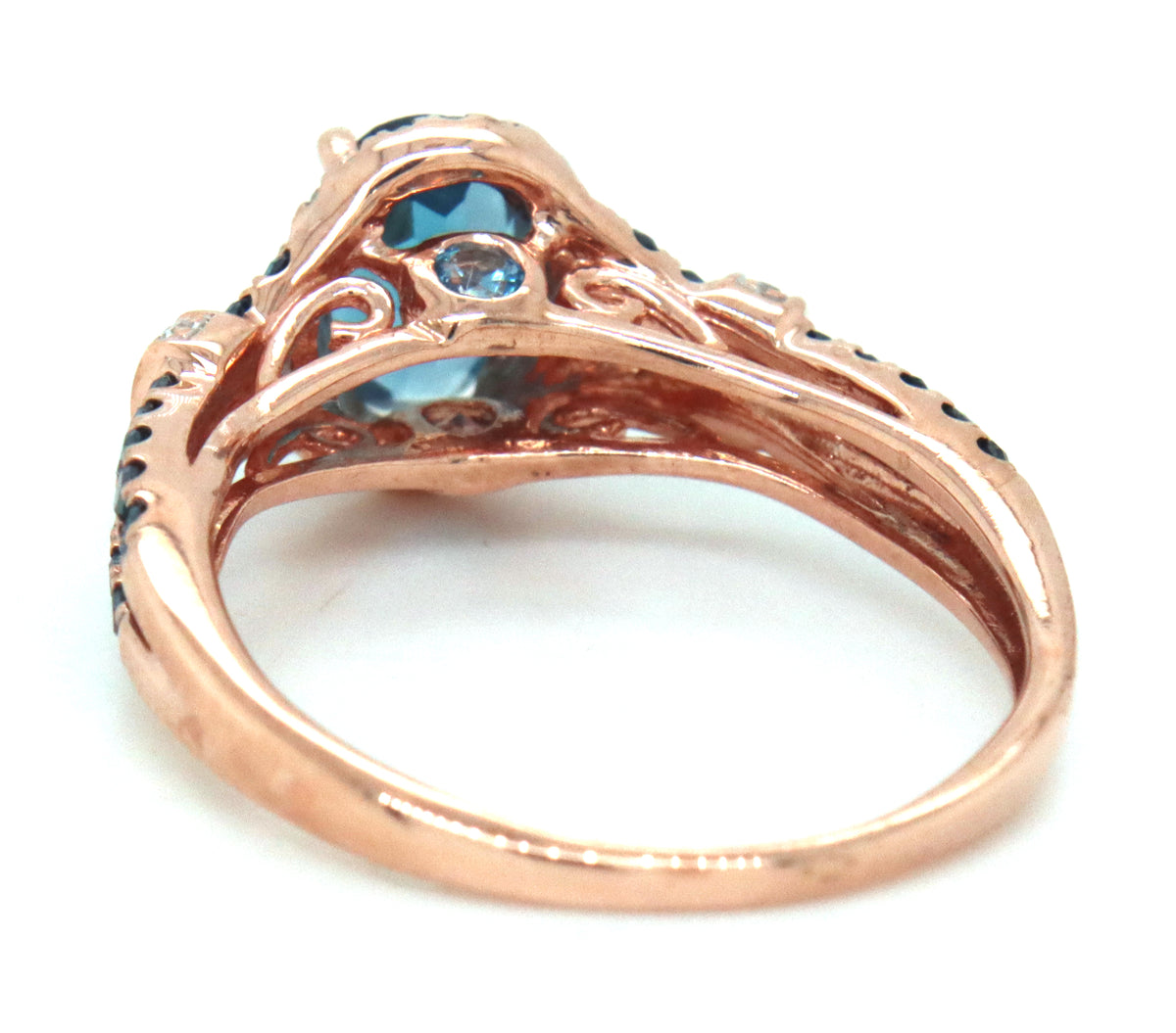 10kt Rose gold oval topaz, IR blue diamond and white diamond double halo ring
