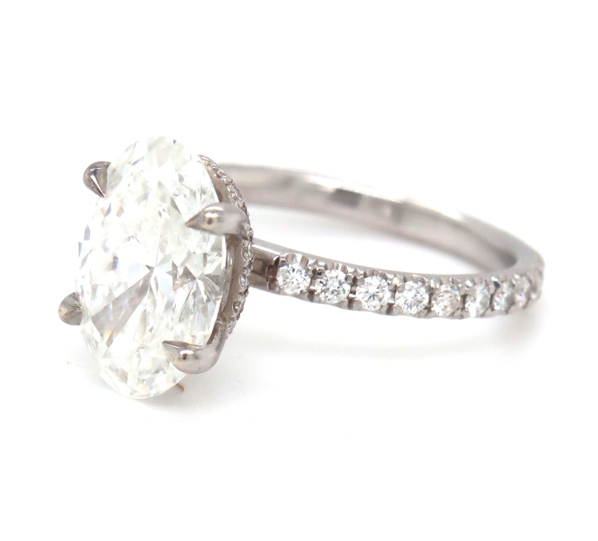 14kt White gold 3.15ct oval lab grown diamond in micro pave ring