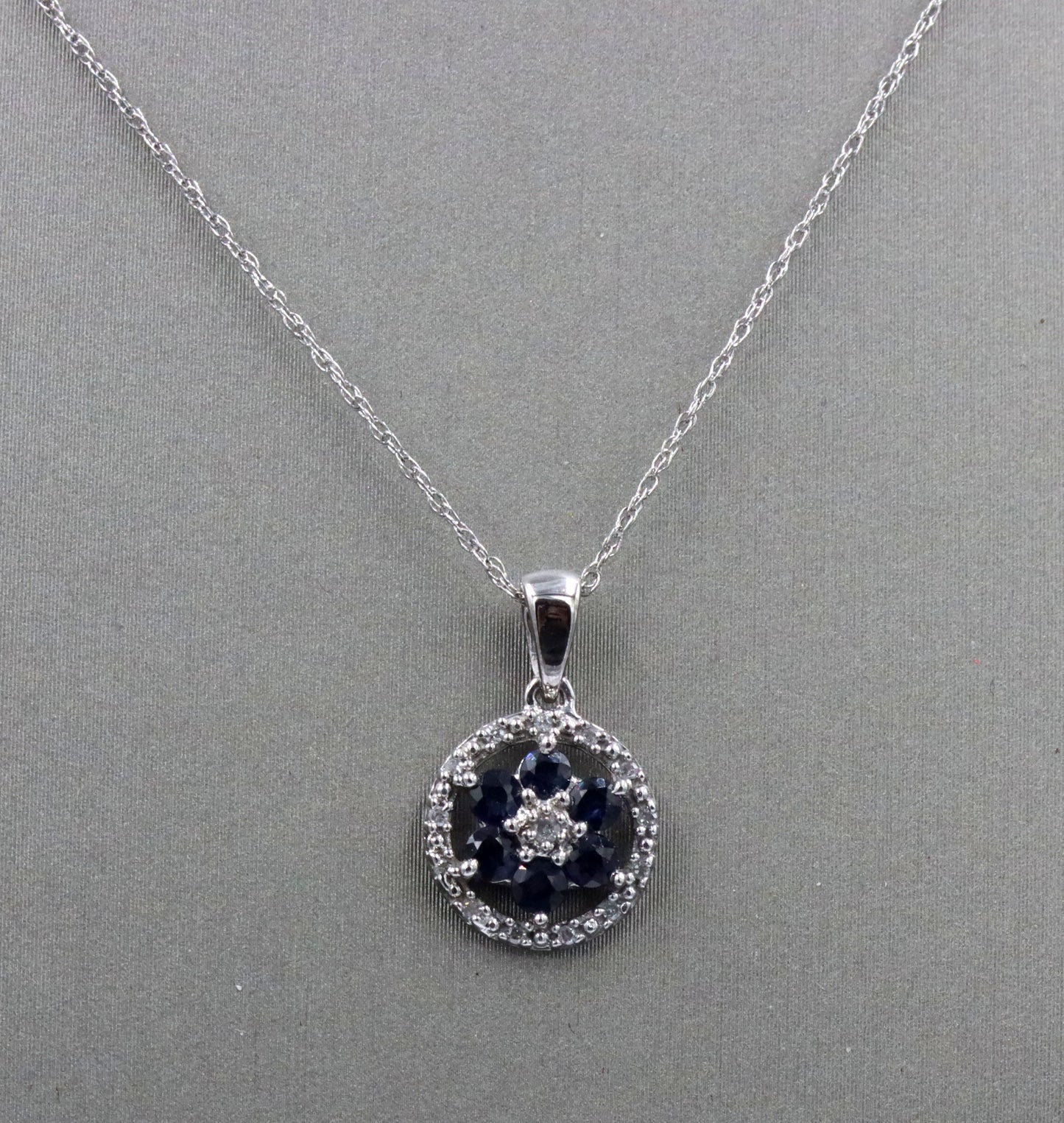 10kt White gold sapphire and diamond halo flower pendant on chain