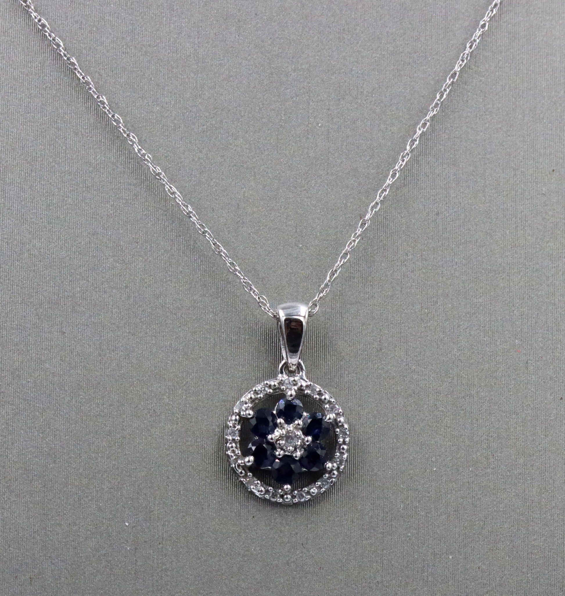 10kt White gold sapphire and diamond halo flower pendant on chain