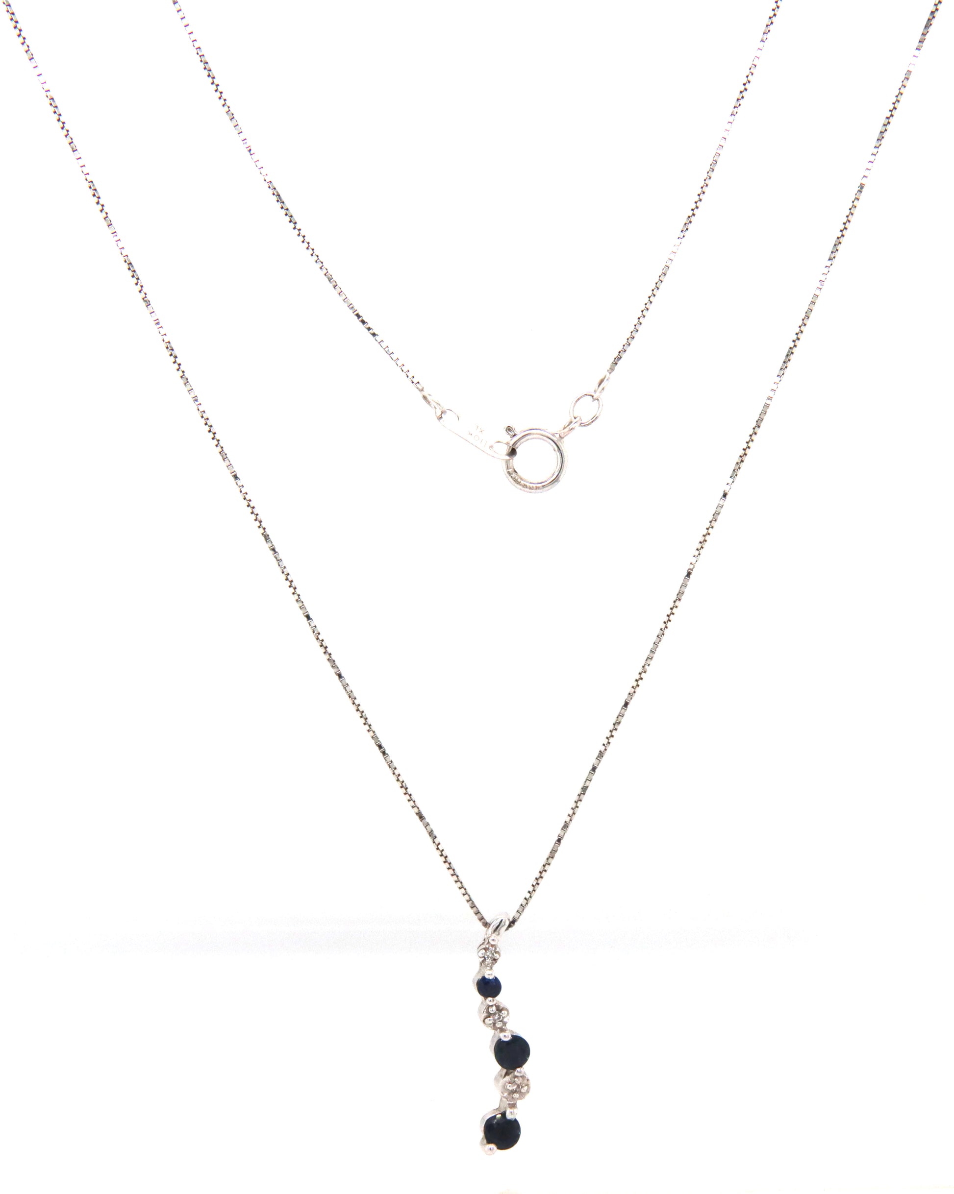 10kt White gold blue sapphire and diamond pendant on chain