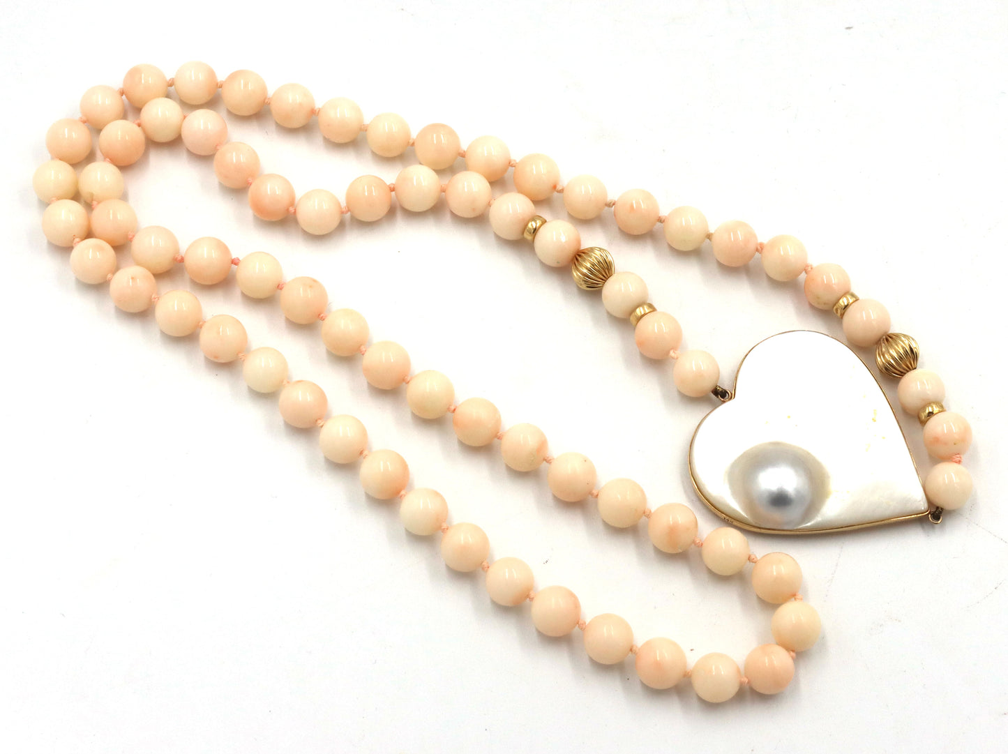 Pink quartz beaded necklace with mother of pearl heat shaped pendant