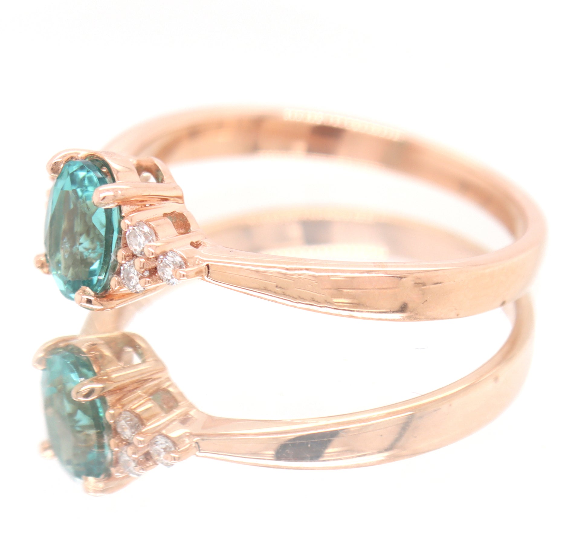 14kt Rose Gold oval Blue Zircona and Diamond Ring