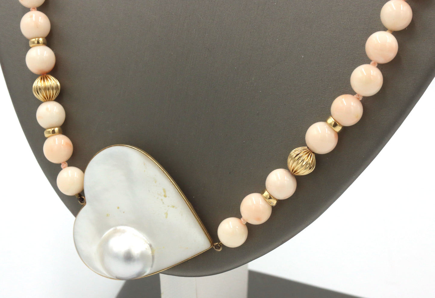 Pink quartz beaded necklace with mother of pearl heat shaped pendant