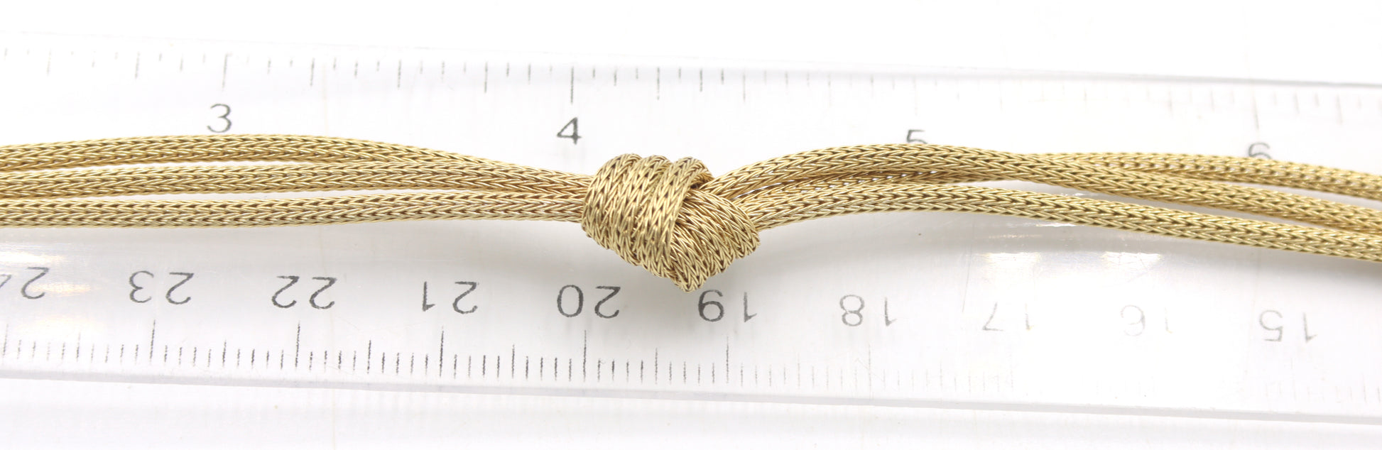 18kt Yellow gold knot pendant on 3 row chain necklace