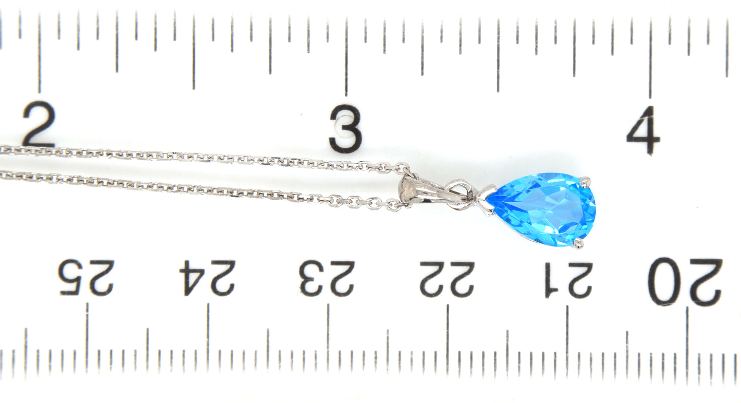 14kt White gold pear shaped blue topaz pendant on chain necklace