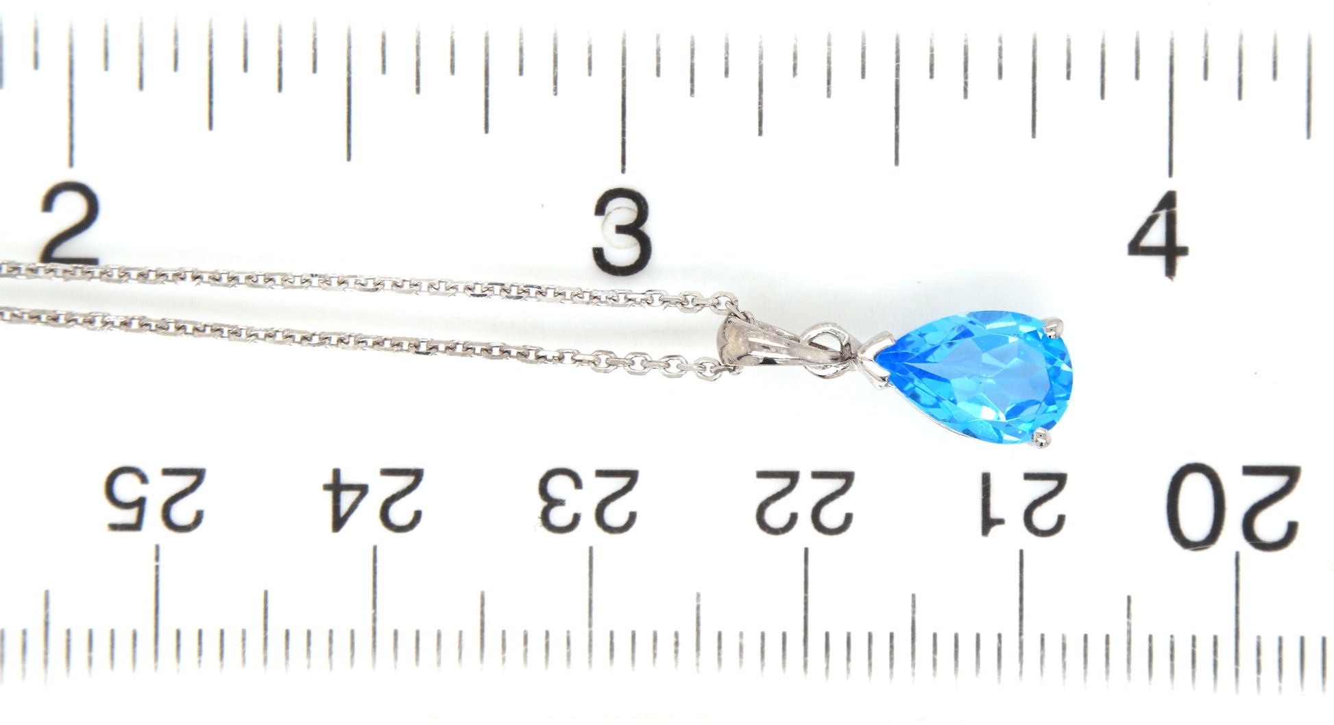 14kt White gold pear shaped blue topaz pendant on chain necklace