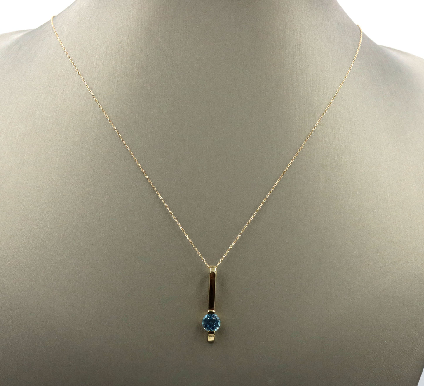 14kt Yellow gold blue topaz bar pendant on chain