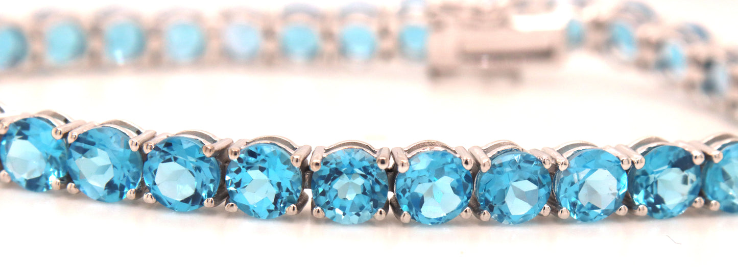 14kt White gold blue topaz link bracelet