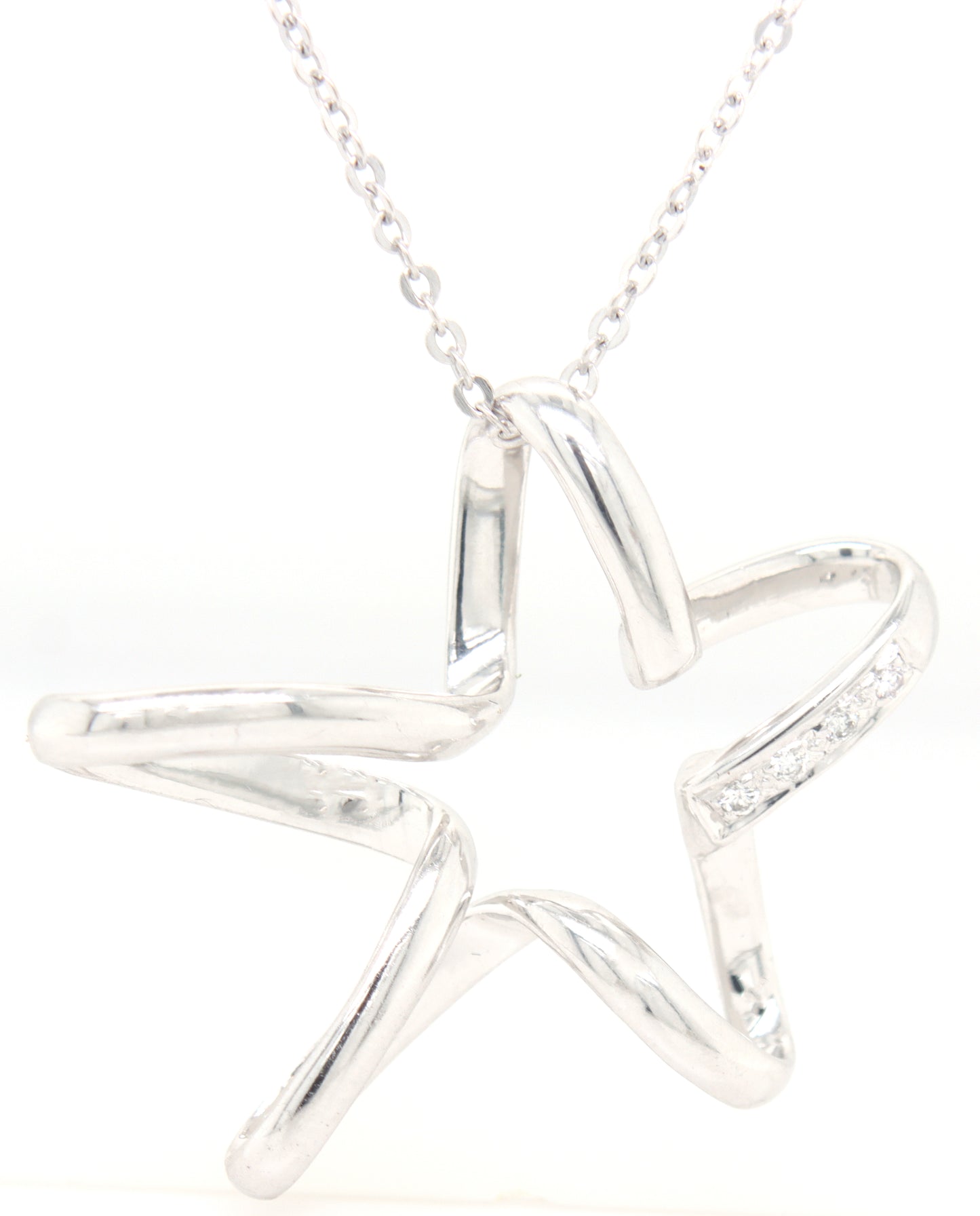 18kt White gold diamond accent free form star pendant on chain