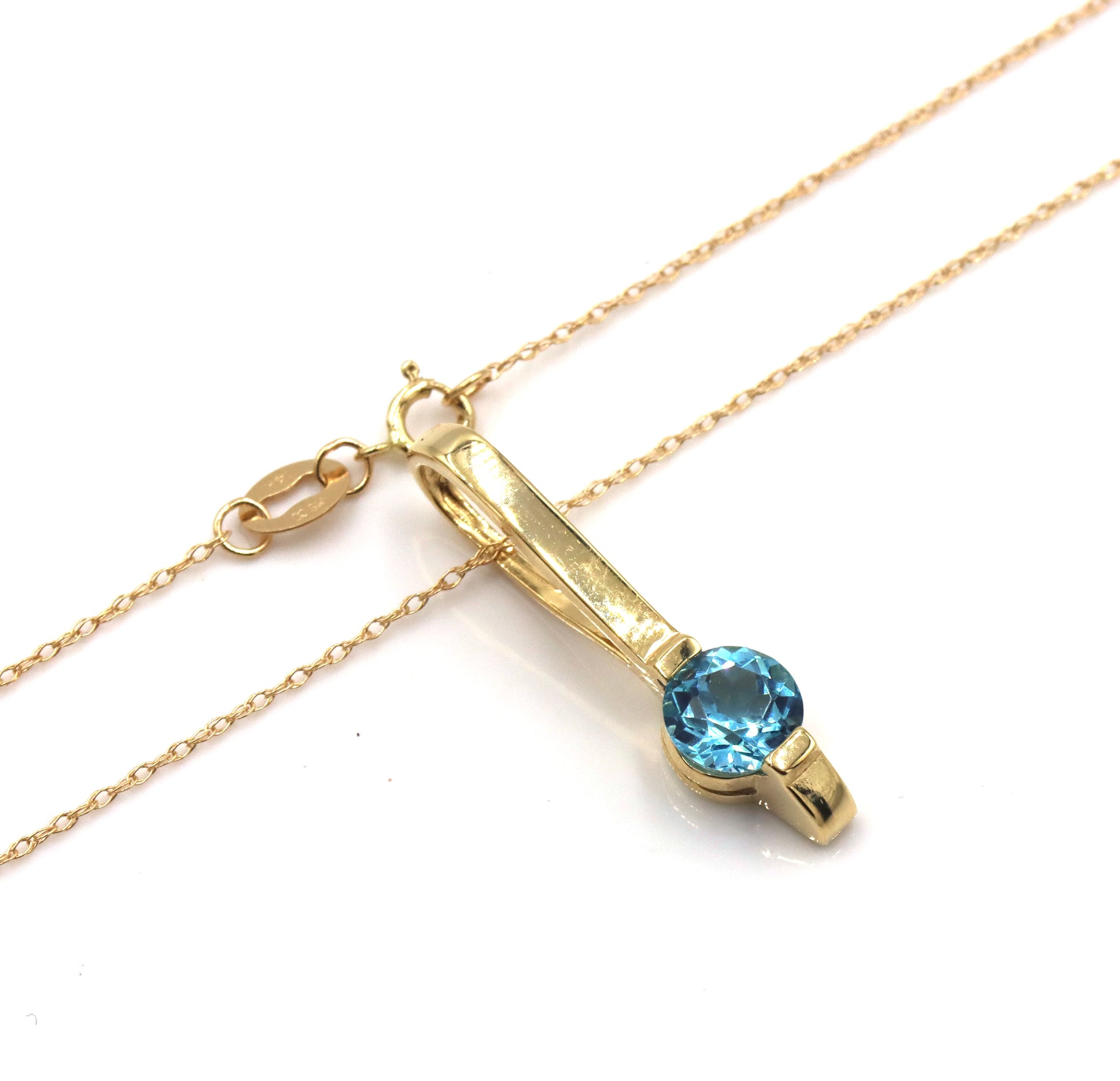 14kt Yellow gold blue topaz bar pendant on chain