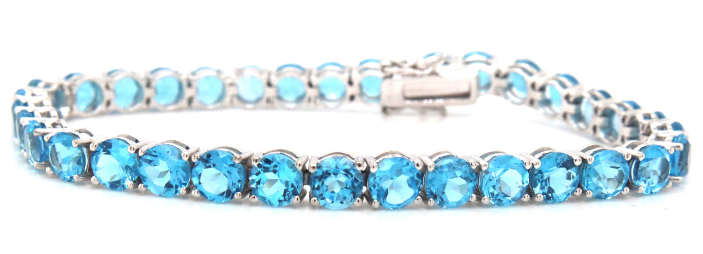 14kt White gold blue topaz link bracelet