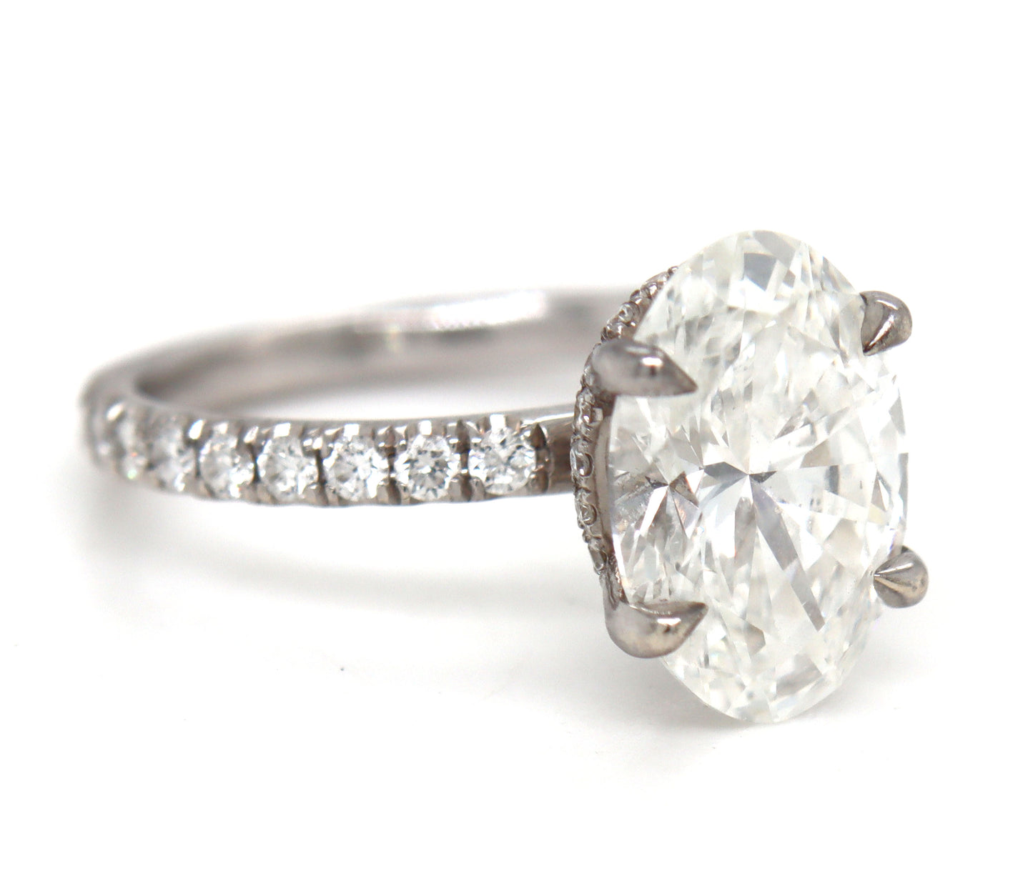 14kt White gold 3.15ct oval lab grown diamond in micro pave ring