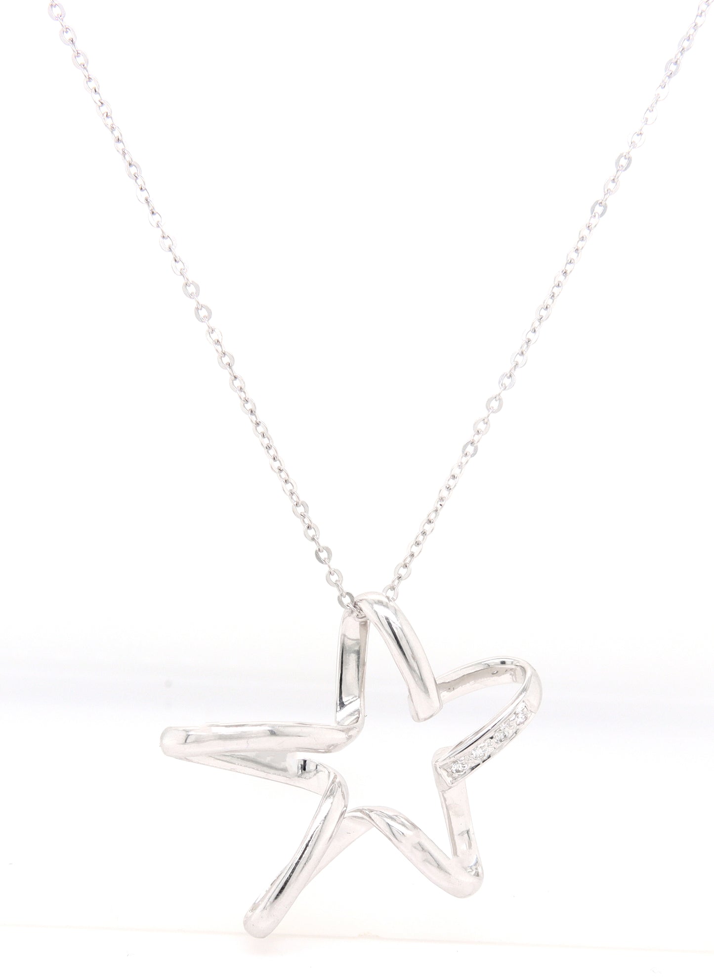 18kt White gold diamond accent free form star pendant on chain