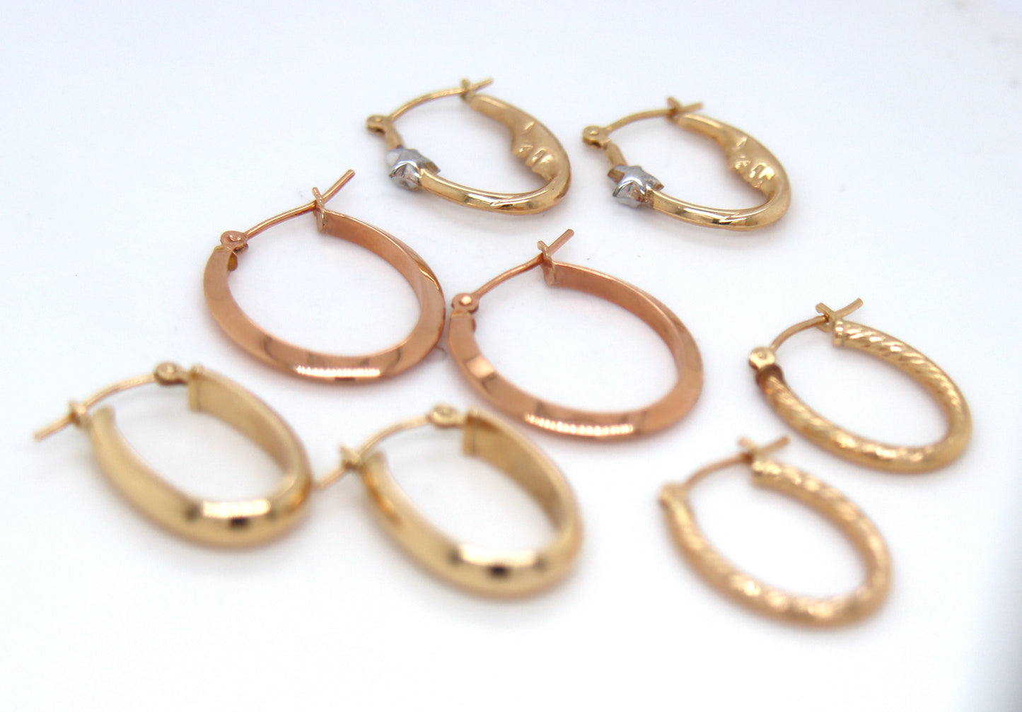 4 Pairs of 14kt yellow gold hoop earrings