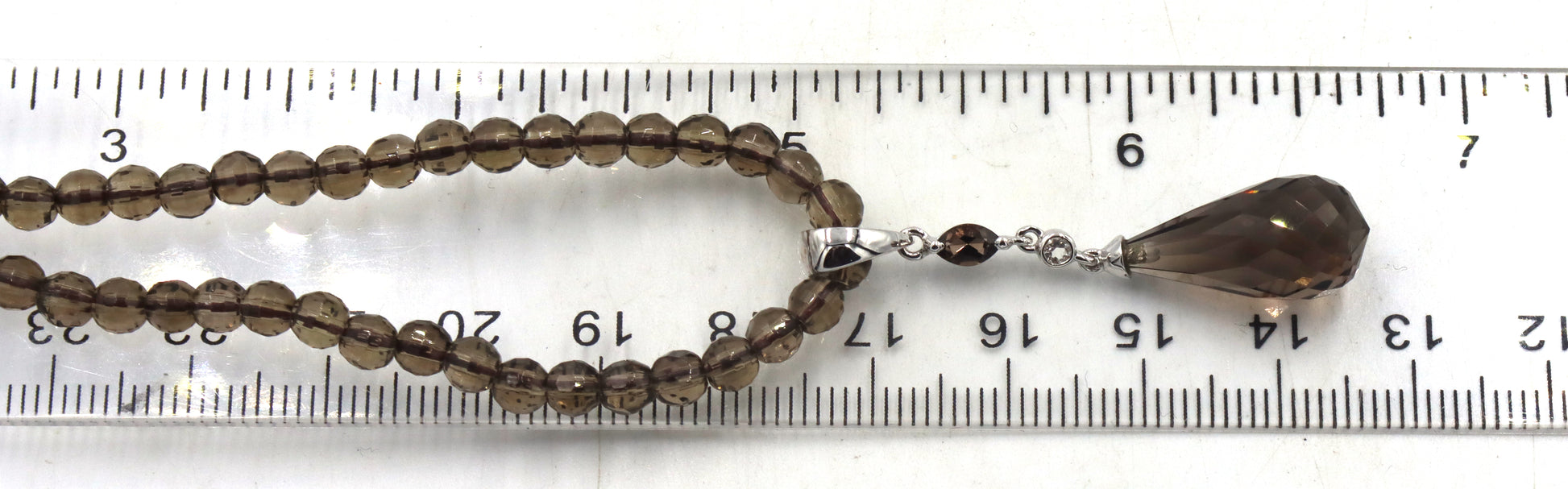 Pear shaped smokey quartz pendant on beaded necklace