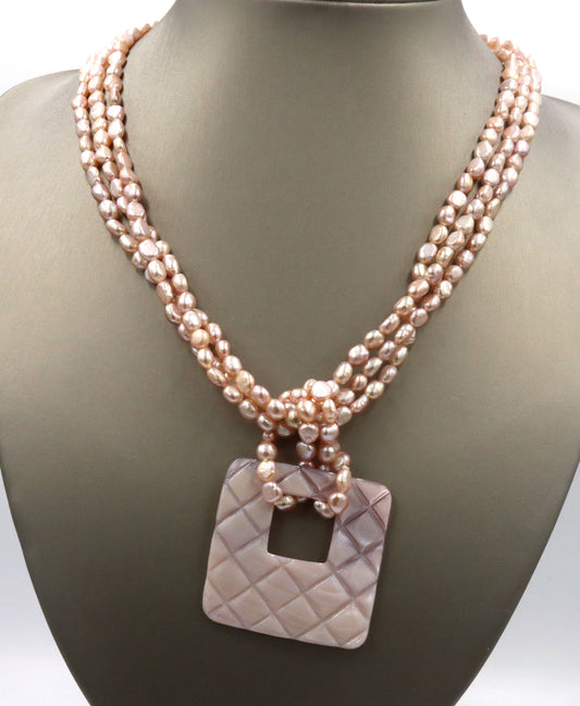 Pearl square pendant on multi strand pearl necklace