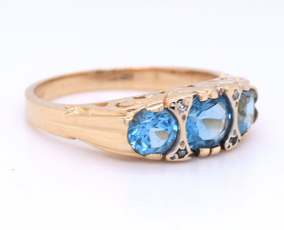 Vintage 14kt yellow gold 3 stone blue topaz and diamond accent ring