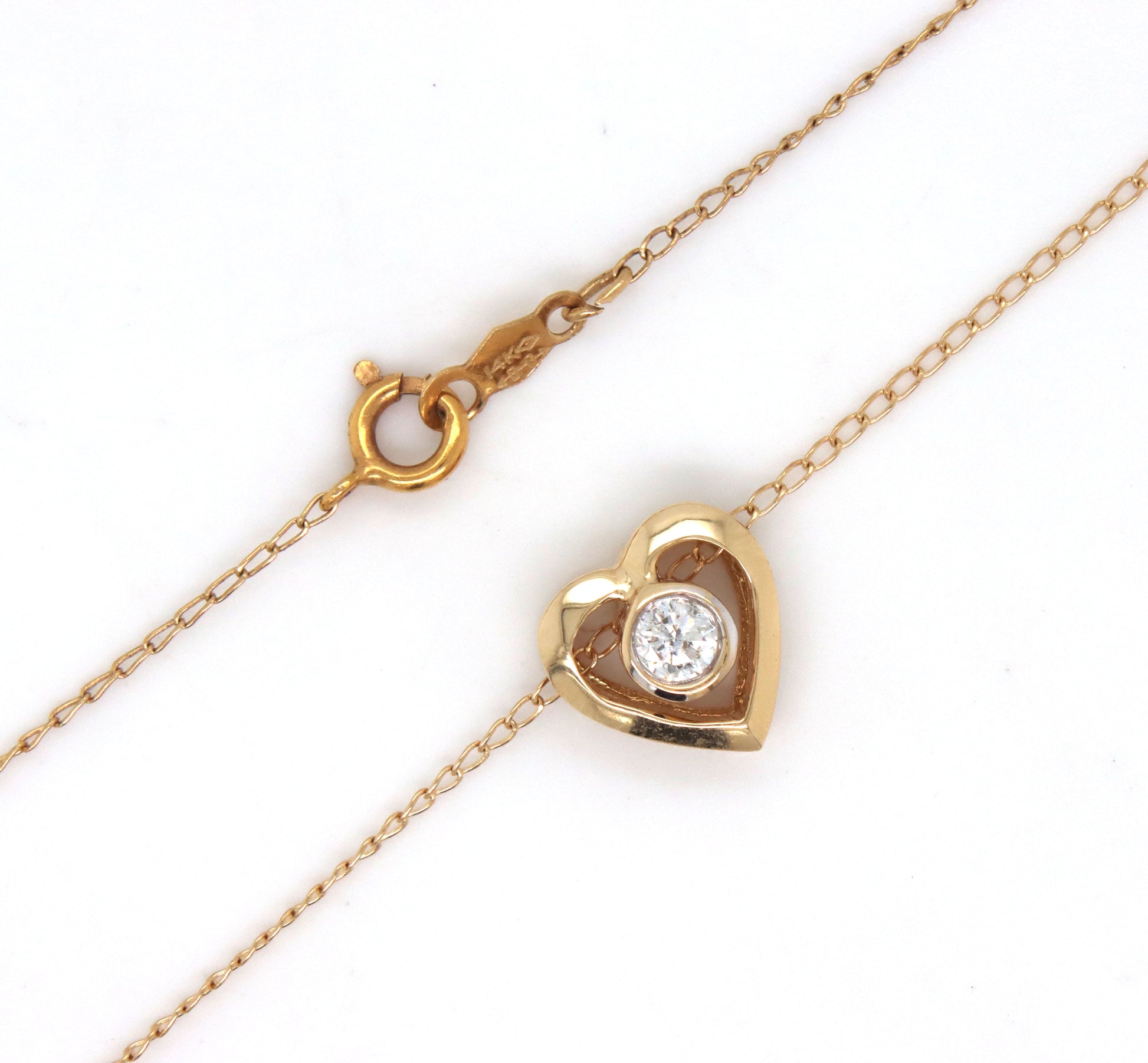 14kt Yellow gold 0.12ct bezel set diamond heart pendant on chain
