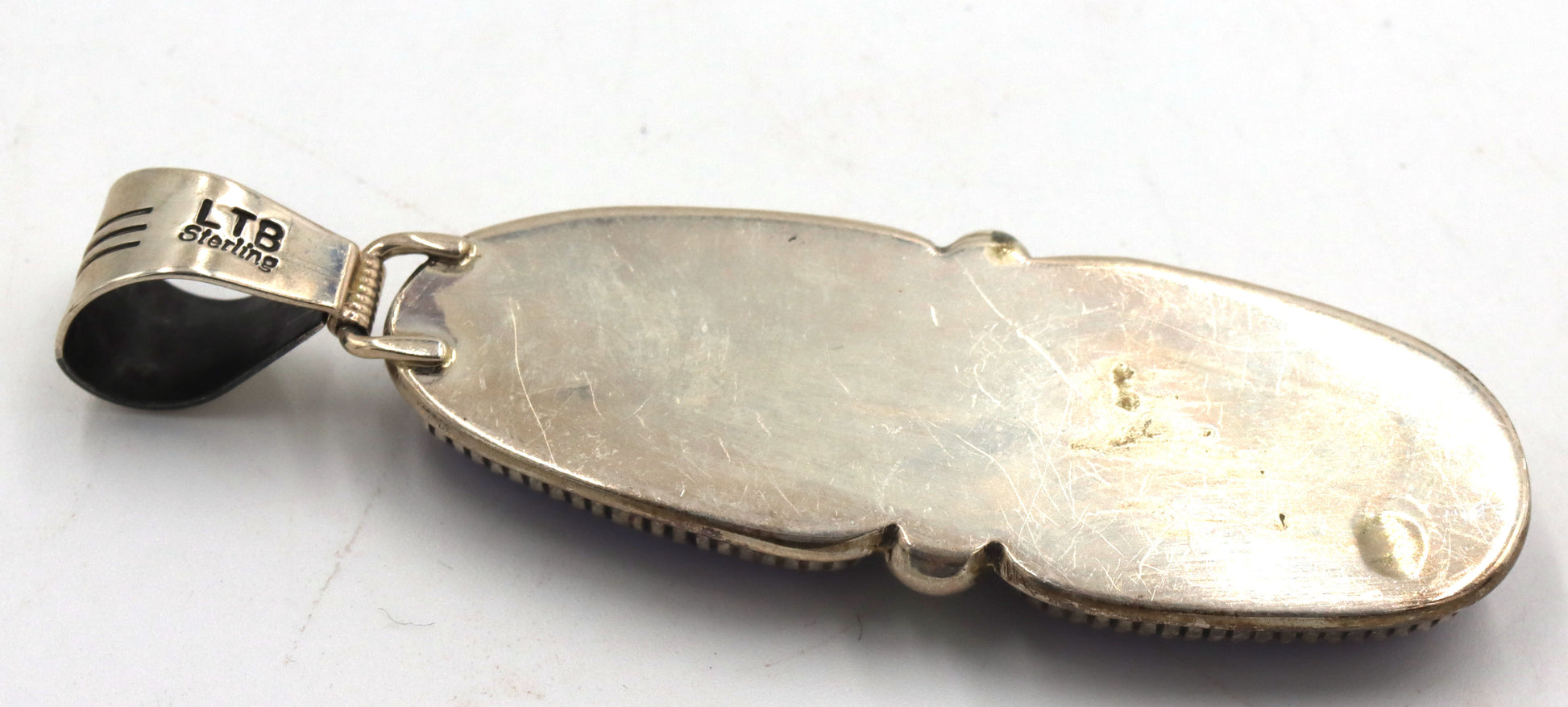 Set of 925 sterling silver signed purple stone pendant and ring