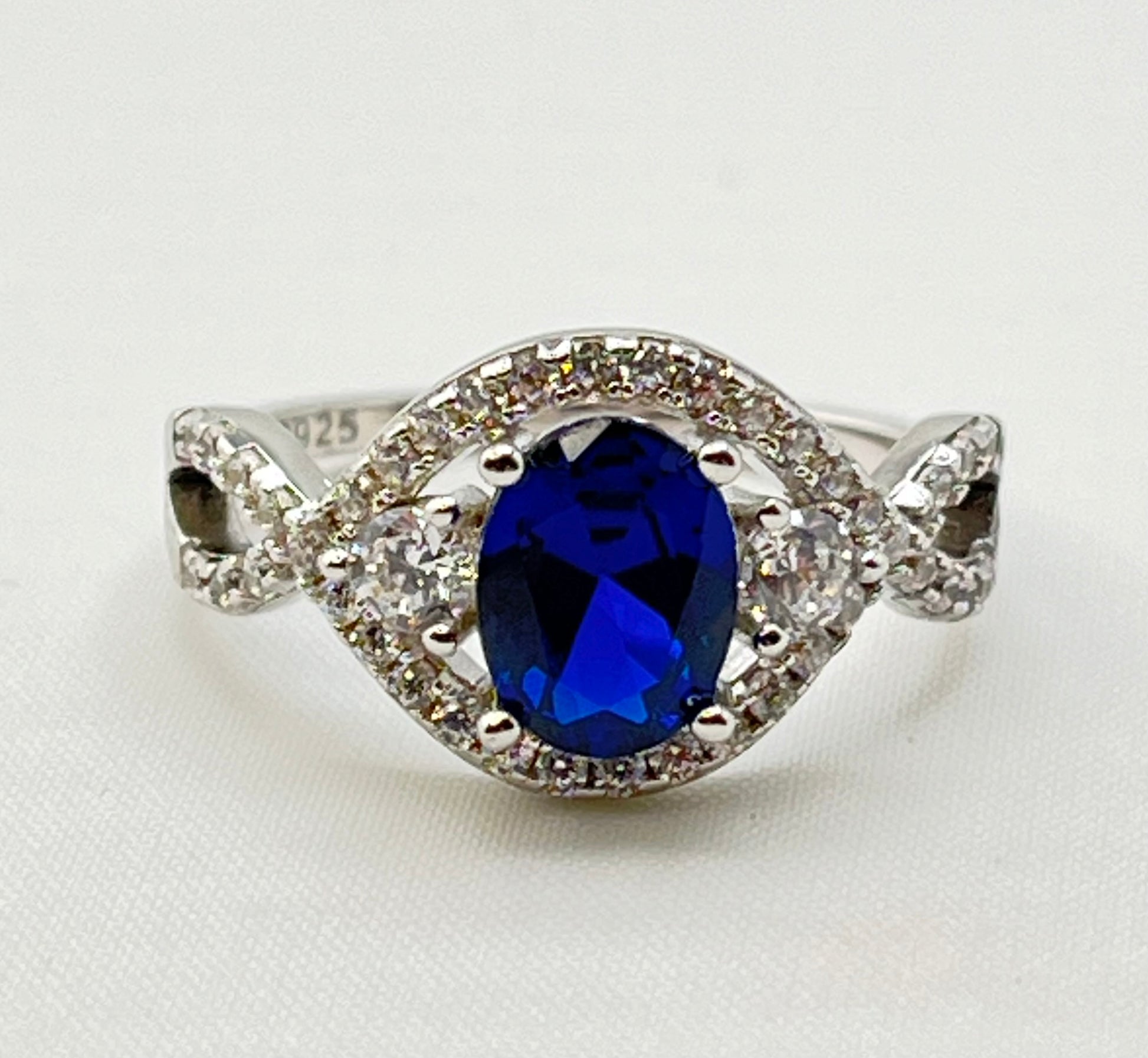 925 Sterling Silver Oval Blue Center Stone With Crystal Pave Details Ring