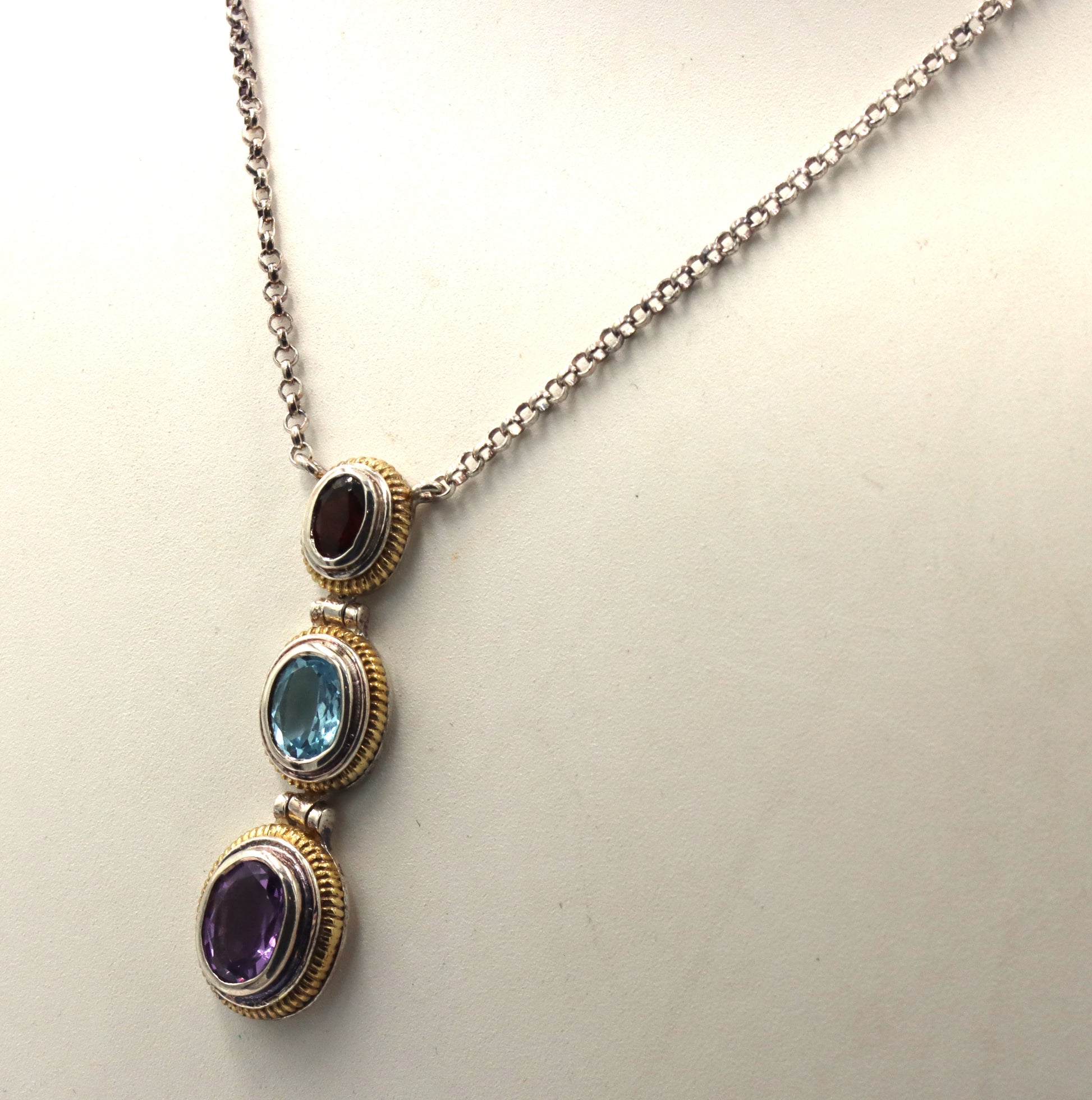 925 Sterling silver signed amethyst, blue topaz and garnet pendant on chain