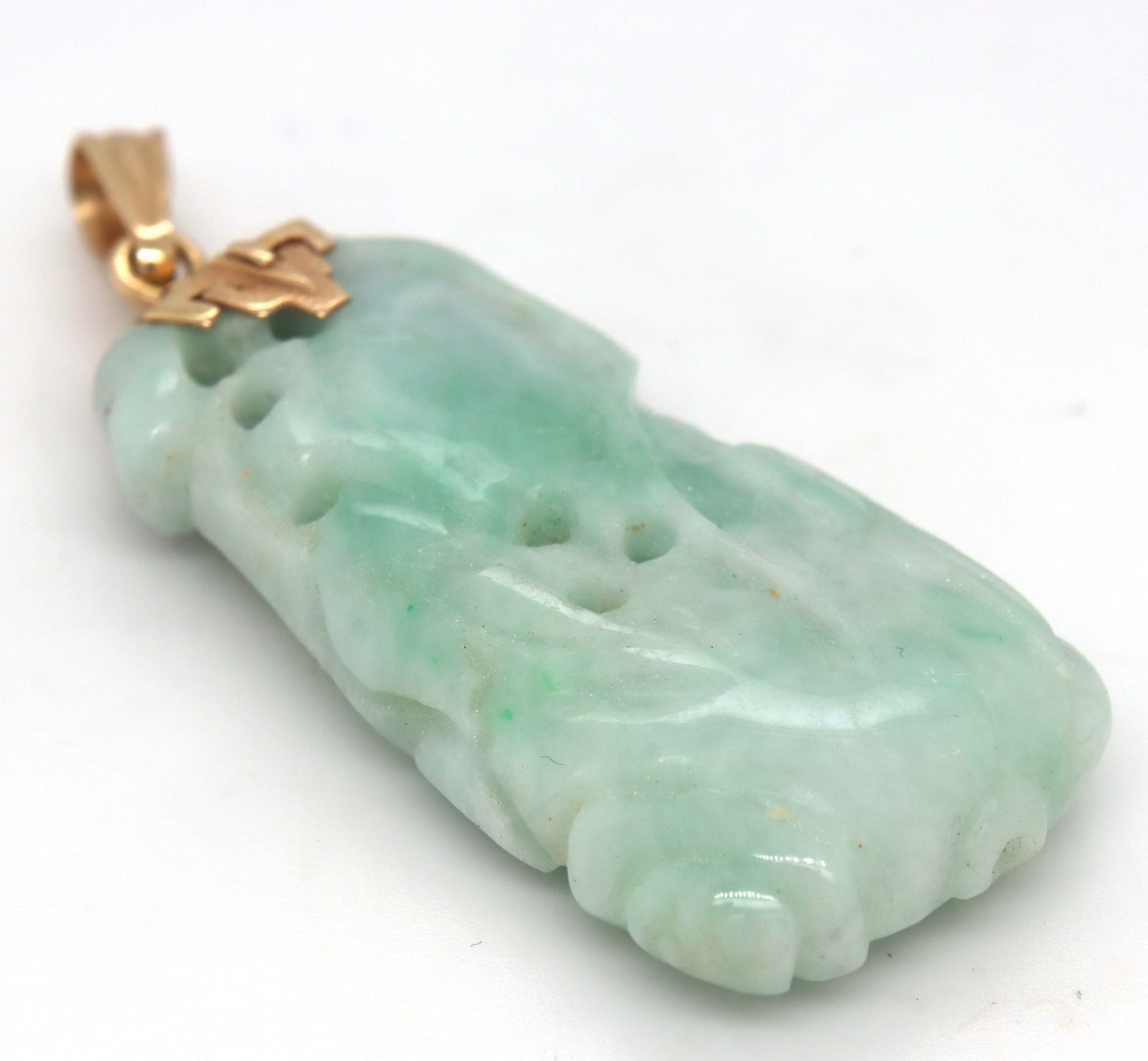 Hand carved green Jade pendant in 14kt yellow gold