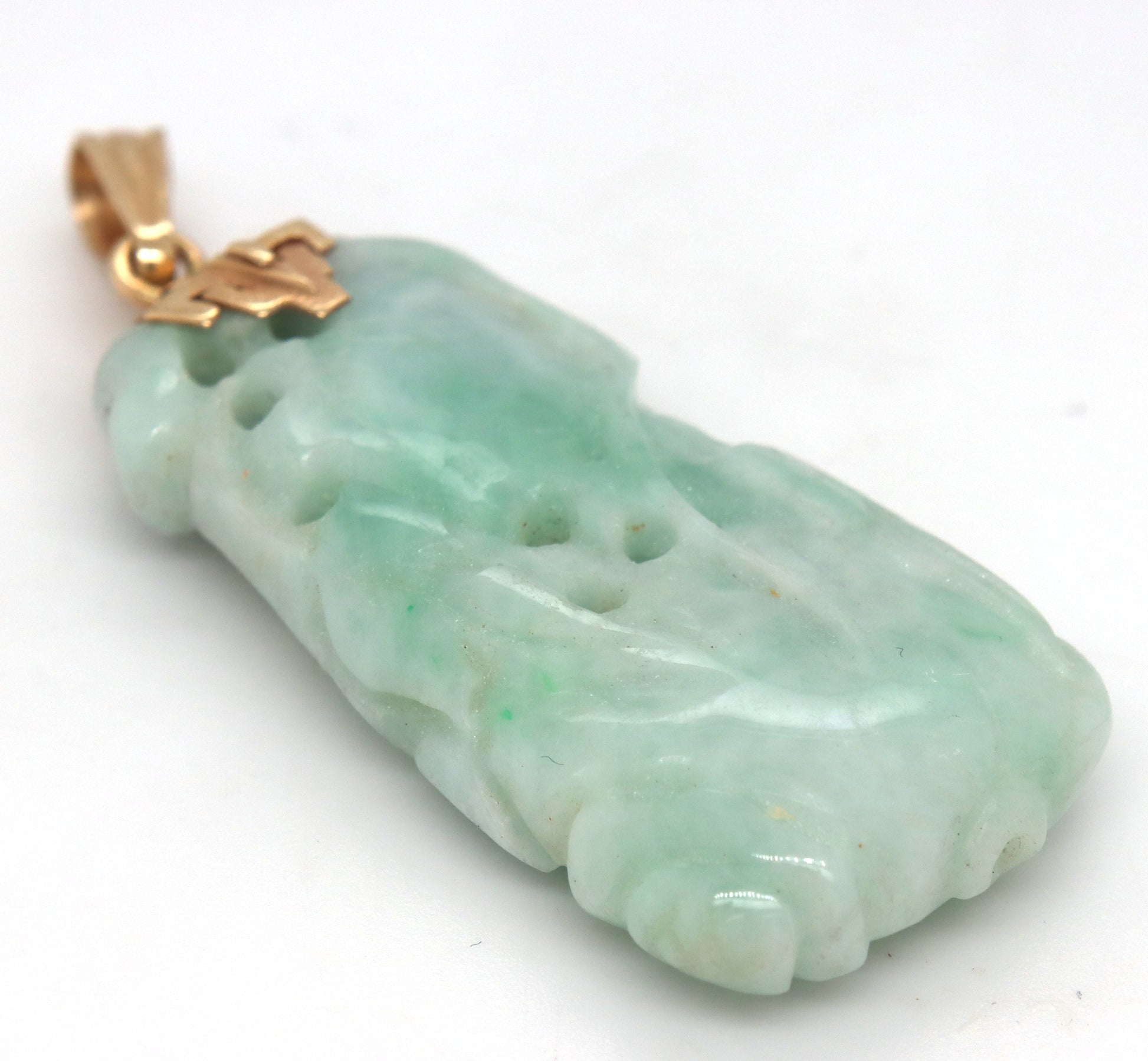 Hand carved green Jade pendant in 14kt yellow gold