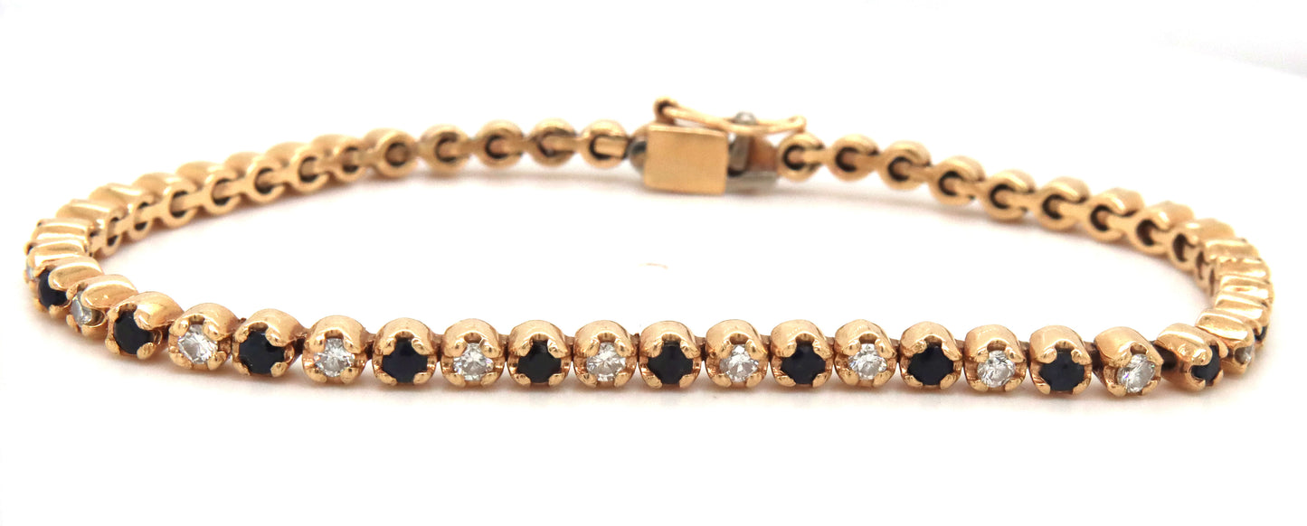14kt Yellow gold round brilliant cut blue sapphire and diamond link bracelet