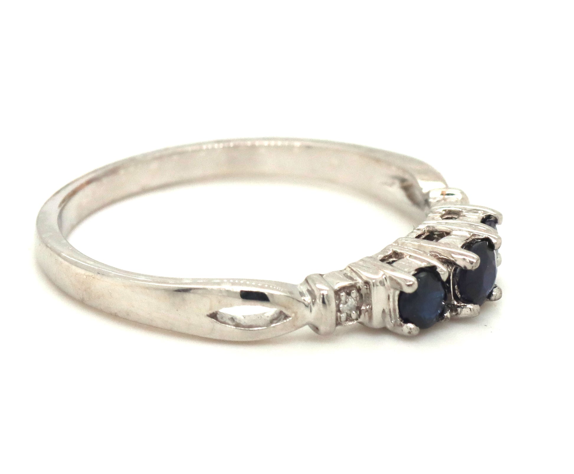 10kt White gold 3 stone sapphire and diamond accent ring