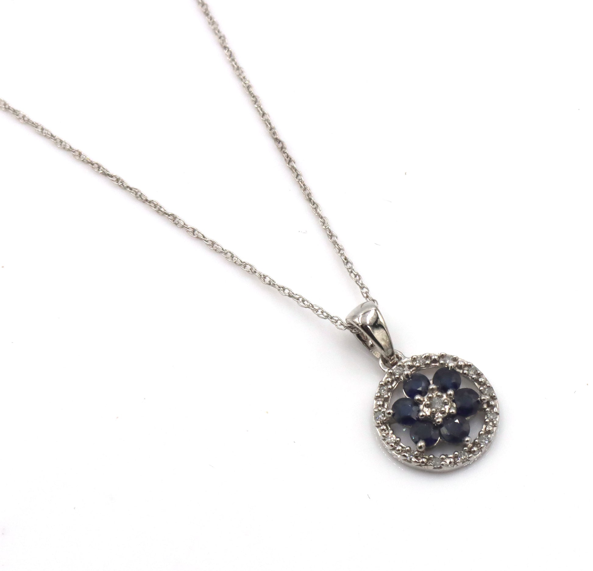 10kt White gold sapphire and diamond halo flower pendant on chain