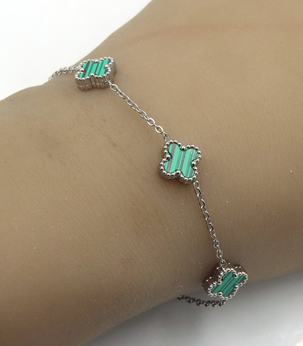 Stainless steel green stone clover station bracelet