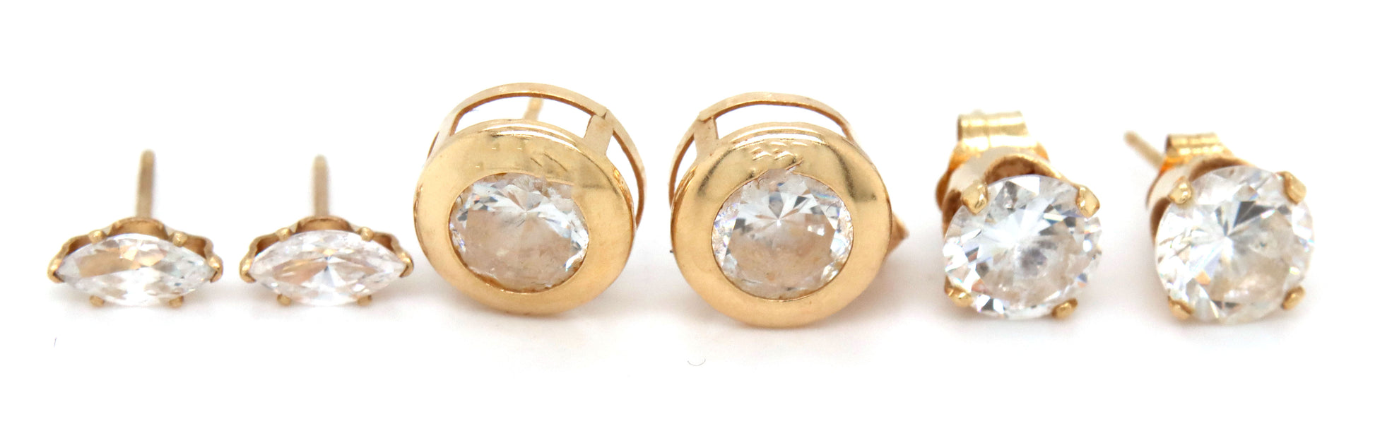 3 Pairs of 14kt yellow gold CZ stud earrings