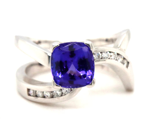 14KT White Gold Ring Features Aa Vibrant 2ct Cushion Cut Tanzanite Set In Criss Cross Band With Natu