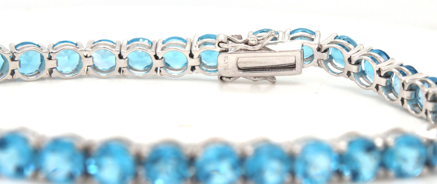 14kt White gold blue topaz link bracelet