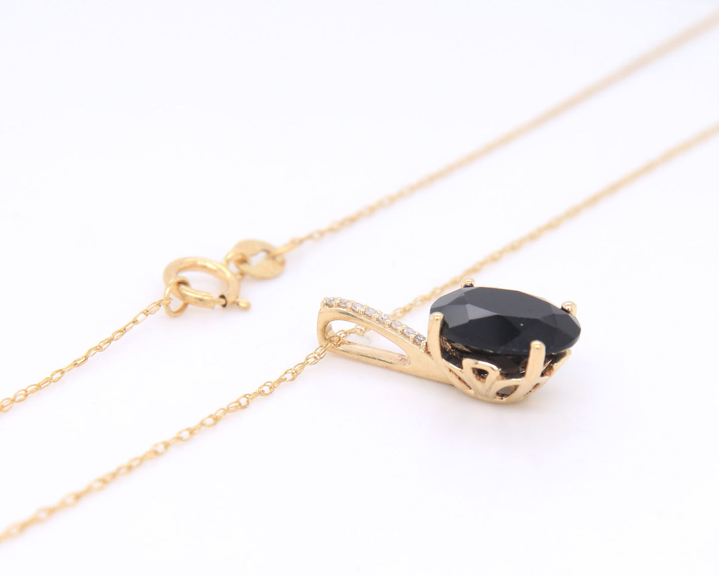 14kt Yellow gold oval black onyx and diamond pendant on chain necklace